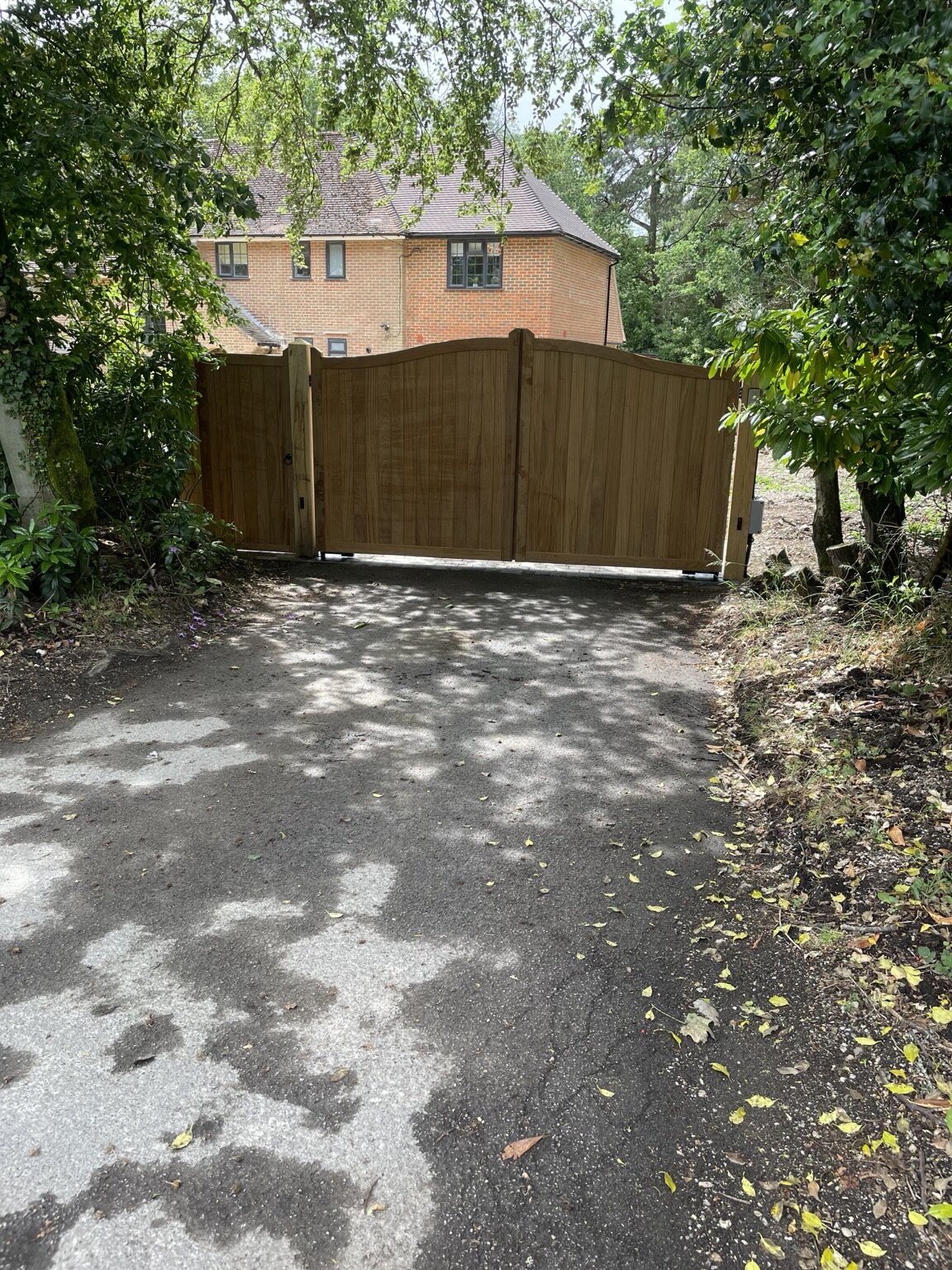 Hardwood automated driveway gates viewed from outside the Hermitage property